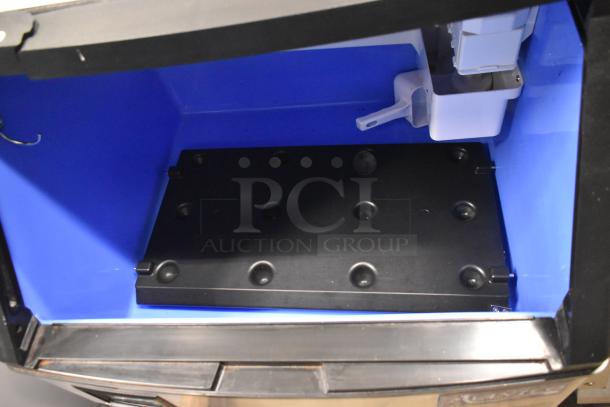 Brand new 2024 Avantco 194UCH160A undercounter half cube ice machine, 160 lb capacity, minor scratches. Interior view shown.