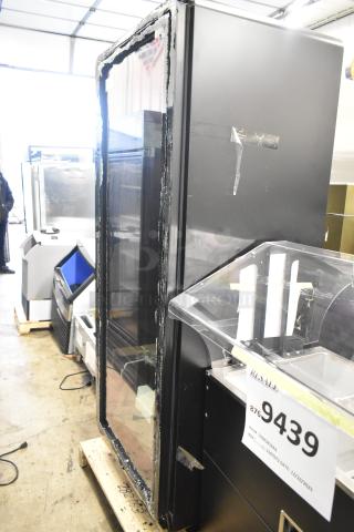 Brand new True CVM-27-HC black glass door merchandiser with LED lighting. Features broken glass. 115 Volts, 1 Phase.