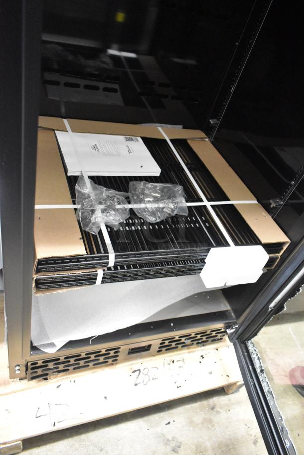 Brand new True CVM-27-HC black refrigerated merchandiser. Features LED lighting, visible glass damage, 115V, 1 phase.