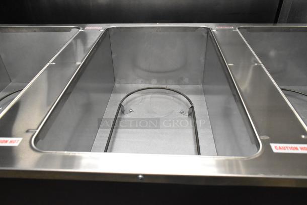 Brand new Advance Tabco B3-120-B-SB hot food table showing open well. Scratch and dent condition. Model 109B3BSBXA.