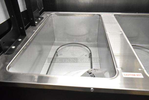 Advance Tabco B3-120-B-SB hot food table, stainless steel, three pan open well, brand new, scratch and dent, "Caution Hot" label.