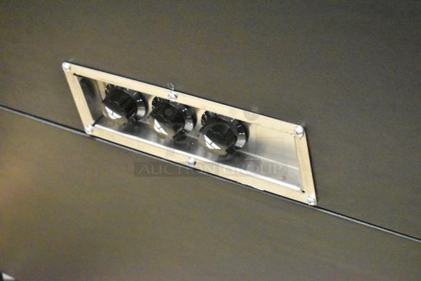 Advance Tabco hot food table controls; three black knobs set in a stainless steel plate, model 109B3BSBXA, new condition.