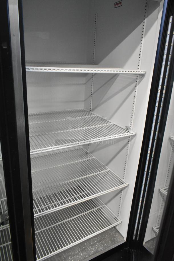 2019 True GDM-72-HC 3 Door Commercial Cooler Merchandiser, white interior, wire shelves, 115V, excellent condition.