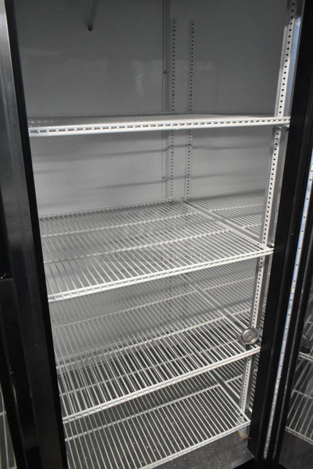 2019 True GDM-72-HC Commercial 3 Door Reach In Cooler, 115V, 1 Phase, white interior, adjustable shelving.