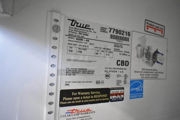True GDM-49 commercial 2-door reach-in cooler tag. Model: GDM-49, 115V, 1 Phase, Energy Star certified, made in USA.