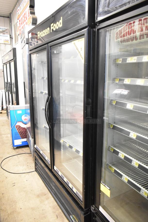 2017 True GDM-49F-HC 2 Door Reach-In Cooler Merchandiser, 115V, 1 Phase, glass doors, shelving inside, "Frozen Food" signage.