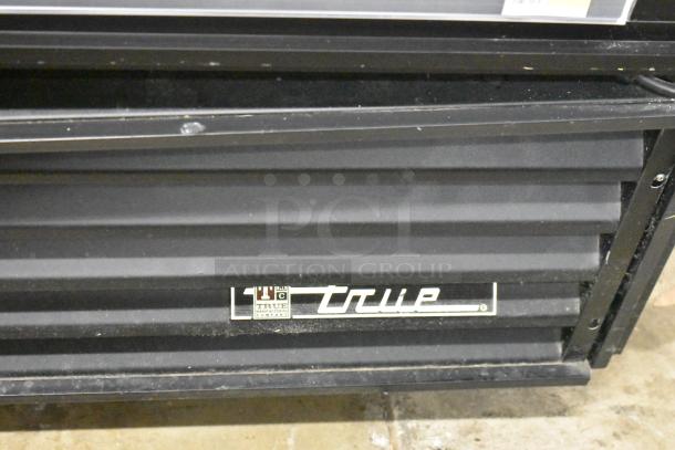 True GDM-72 Commercial Cooler, 3-door, 115V, 1 phase, True logo visible on black exterior.