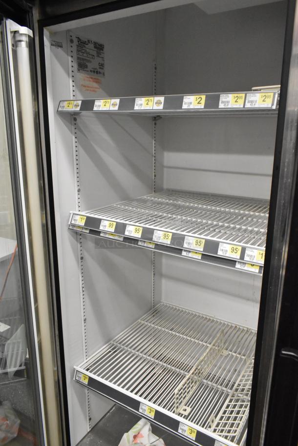 True GDM-72 Commercial 3 Door Cooler, white interior, shelving, model label visible, 115V, 1 Phase.