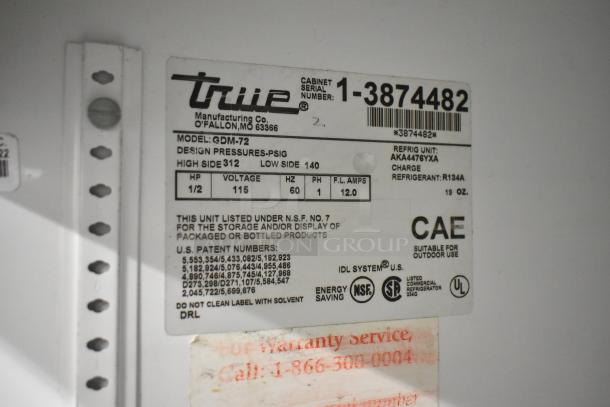 True GDM-72 cooler label showing model, voltage (115V), phase, refrigerant type R134A, and NSF certification details.