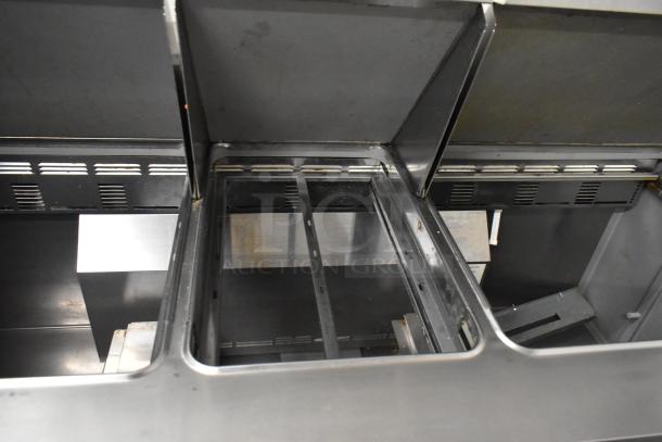 Delfield 4472N-30M-TS11 prep table interior, stainless steel, on commercial casters, used condition.