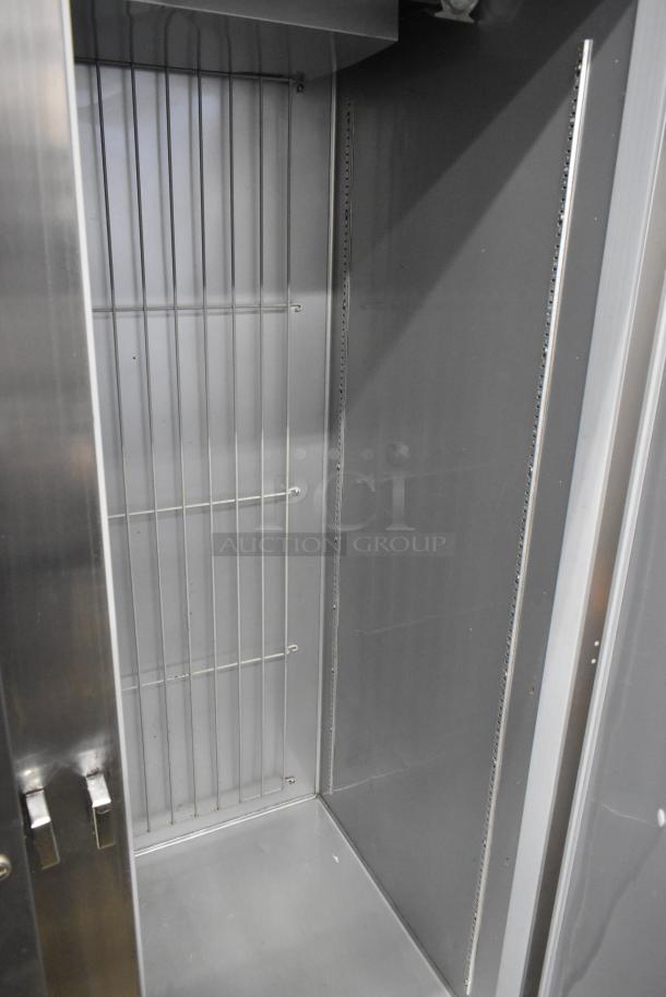 Beverage Air HR2-1S commercial 2-door reach-in cooler interior, stainless steel, on casters, visible wire shelves, 115V, 1 phase.