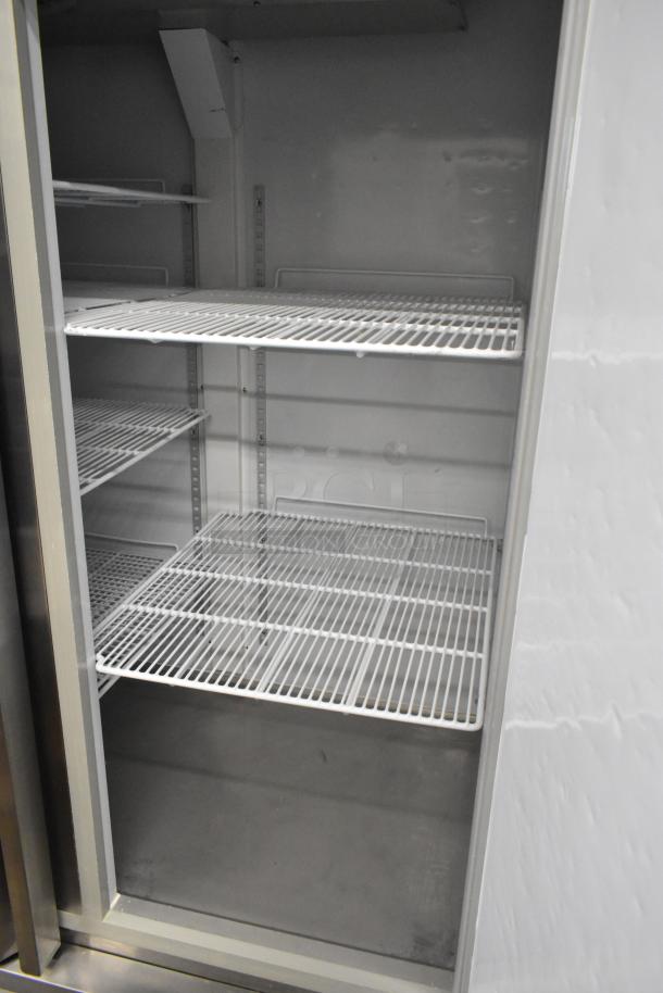 Kratos 68K-774HC commercial 2-door reach-in freezer with wire shelving and commercial casters. 115 volts, 1 phase.