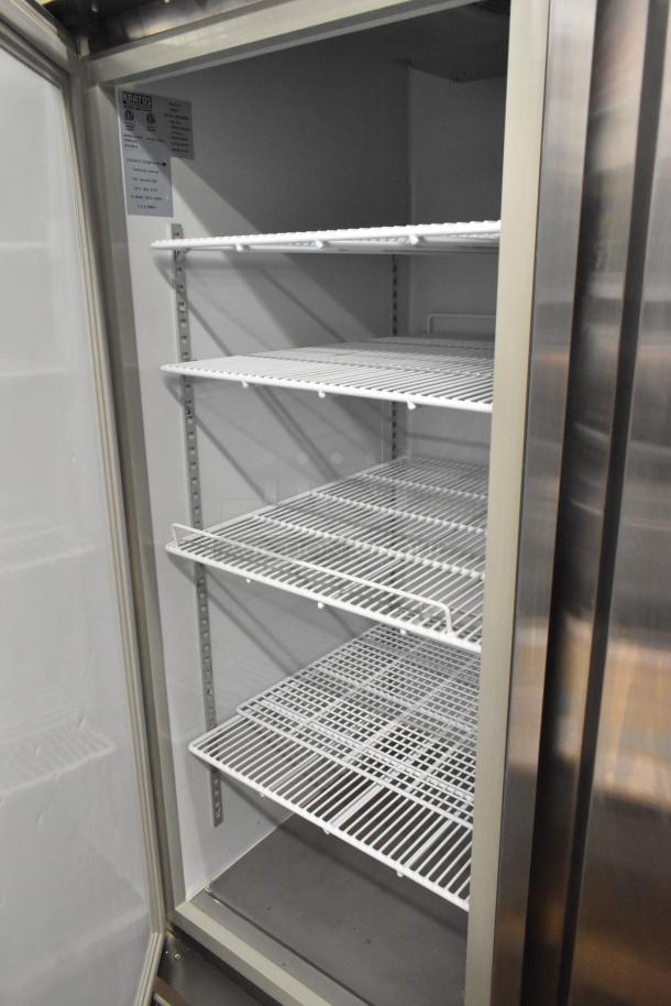 Kratos 68K-774HC commercial 2-door reach-in freezer with wire shelves, stainless finish, on casters. 115V, 1 phase, interior view.