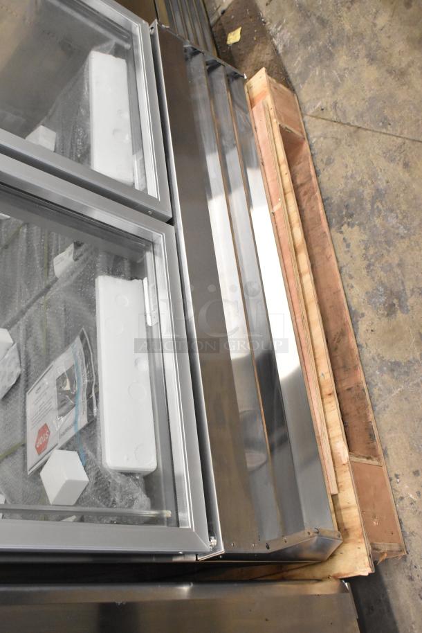 Brand new KoolMore RIR-2D-GD commercial cooler, 2 glass doors, scratch and dent condition, 115V, 1 phase, on wooden pallet.