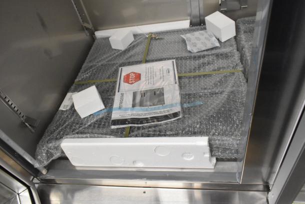 BRAND NEW KoolMore RIR-2D-GD 2 Door Reach-In Cooler, 115 Volts, 1 Phase, packaging visible, minor scratches and dents.