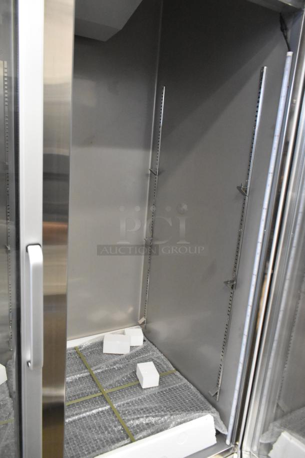 BRAND NEW 2025 KoolMore RIR-2D-GD Commercial 2 Door Cooler. Interior shows protective packaging; minor scratches visible. 115V, 1 Phase.