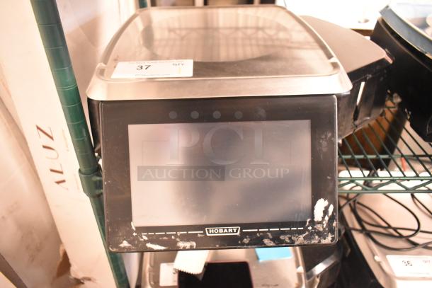 2017 Hobart HTi-7LH26 metal commercial countertop food portioning scale, tested and working, visible wear on the front.