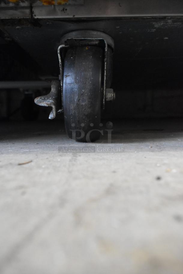 Turbo Air M3F47-2-N commercial freezer caster wheel; durable and suited for easy movement.