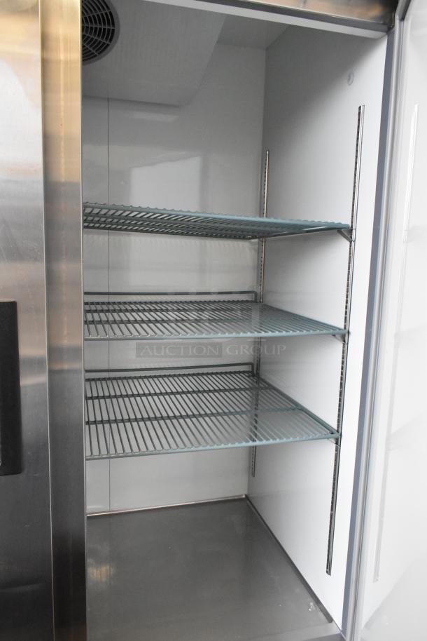 2025 Avantco 178A49RHC Commercial 2 Door Reach-In Cooler with wire shelves, stainless steel interior, on casters, 115V, 1 Phase.