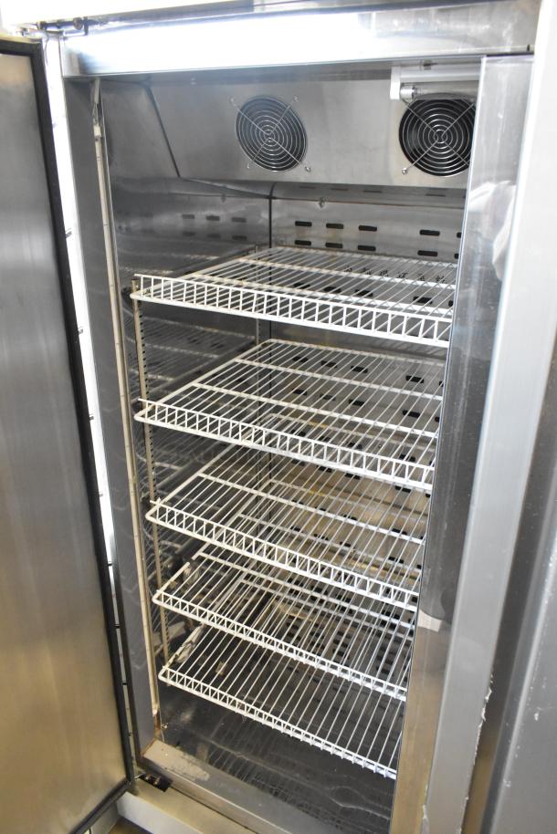 2021 COW800 Commercial 2 Door Reach In Cooler, 115V, 1 Phase, on casters, shows interior shelves, used, good condition.