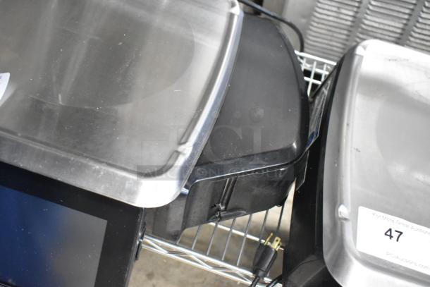 Hobart HTi-7LH4W metal commercial food portioning scale on display. Steel build, tested and working, with visible plug.