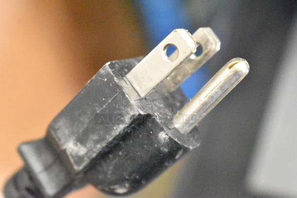 Close-up of a plug for the 2023 Hobart HTi-7LH4W metal commercial countertop food portioning scale, 120/208-240V.