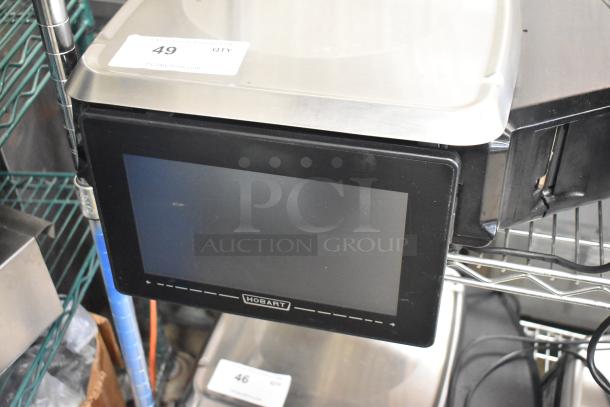 2024 Hobart HTi-7LH4W metal countertop food portioning scale in tested working condition, with digital display.