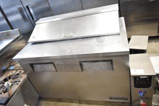 True TSSU-48-12 commercial sandwich salad prep table on casters, 115 volts, 1 phase. Stainless steel, dual doors, durable design.