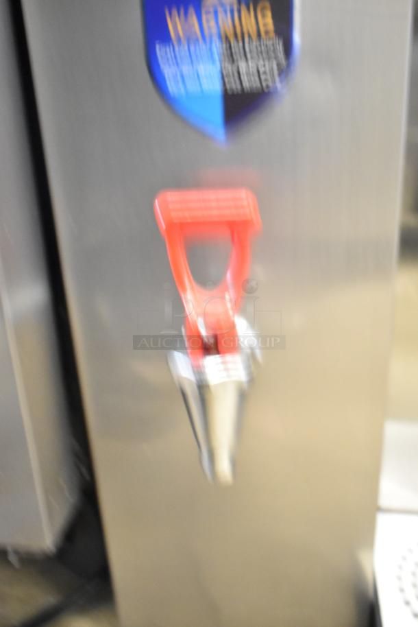 Wonder AMZ-B-20 countertop hot water dispenser, 120V, 1 phase. Features red tap and warning label. Good condition.