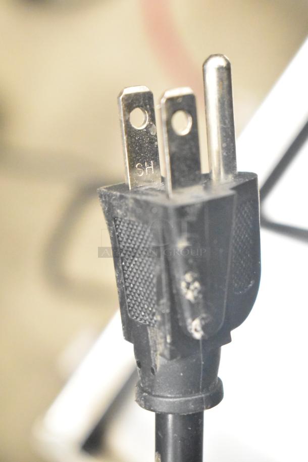 Close-up of a power plug for the Wonder AMZ-B-20 commercial countertop hot water heater, indicating 120 volts, 1 phase.