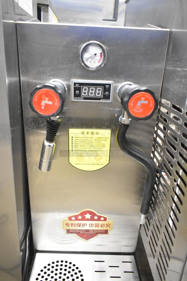 Sonuto SZ-200 Commercial Hot Water Dispenser, 220V, featuring dual nozzles, digital display, safety labels, in stainless steel.