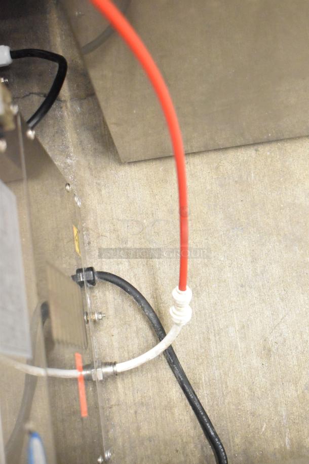 Sonuto SZ-200 commercial hot water dispenser, 220V, 1 phase; features red and black tubing, shown in operational condition.