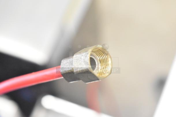 Close-up of a red wire connection for Sonuto SZ-200 Hot Water Dispenser, showcasing metal fitting and threads.