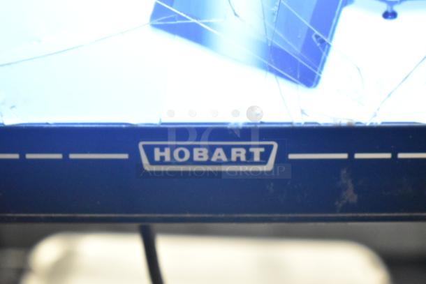 Hobart HTi-7LH4W metal countertop food portioning scale, 2021 model, in working condition. Features branded label.