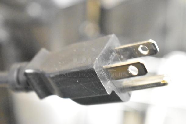 Close-up of a power plug for the 2016 Hobart HTi-LH commercial food portioning scale.