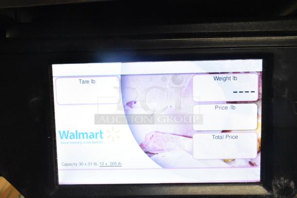 2017 Hobart HTi-7LH26 commercial food portioning scale display showing tare, weight, price per pound, and total price options.