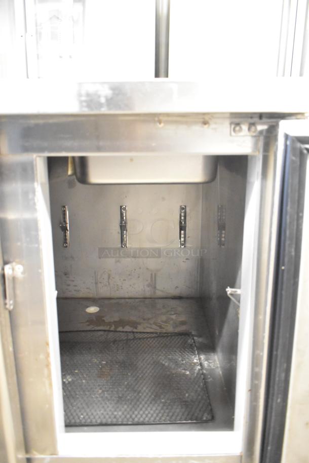 Lasbem HZ0.2L2-CPL commercial prep table, interior view. Stainless steel, used condition, 220V, 1 phase. Open top design.