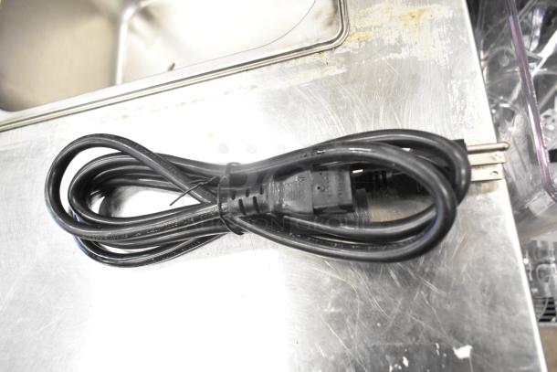 Coiled black power cord, standard three-prong plug, likely for Narvon beverage dispenser model 378RBD5G3, 115 volts, 1 phase.
