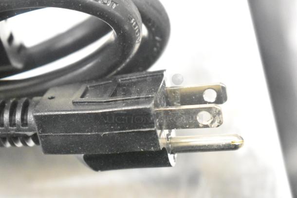 Close-up view of a power plug for Narvon 378RBD5G3 beverage dispenser, 115 Volts, 1 Phase, showing prongs and black cable.