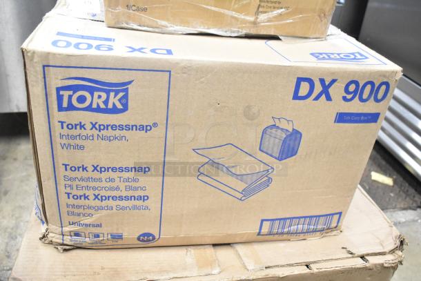 Box of Tork DX900 Xpressnap Interfold Napkins, white, visible packaging details, 1 case in new condition.