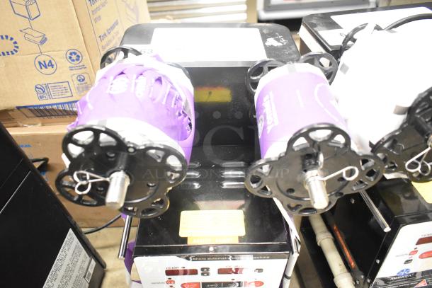 Autata ATT-95N automatic plastic cup sealing machine, 115 volts, 1 phase, black exterior, visible labels and control panel.