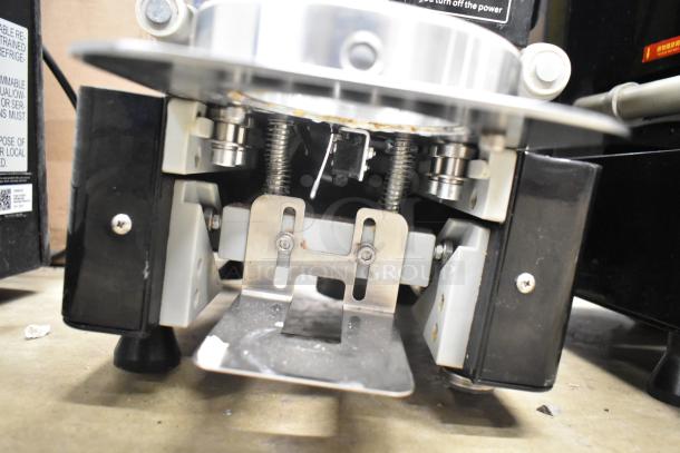 Autata ATT-95N automatic plastic cup sealing machine, 115V, 1 phase. Visible springs and metallic components in used condition.