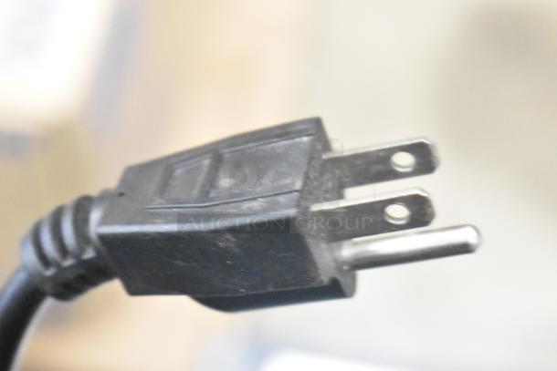 Close-up of a power plug for the Autata ATT-95N automatic plastic cup sealing machine.