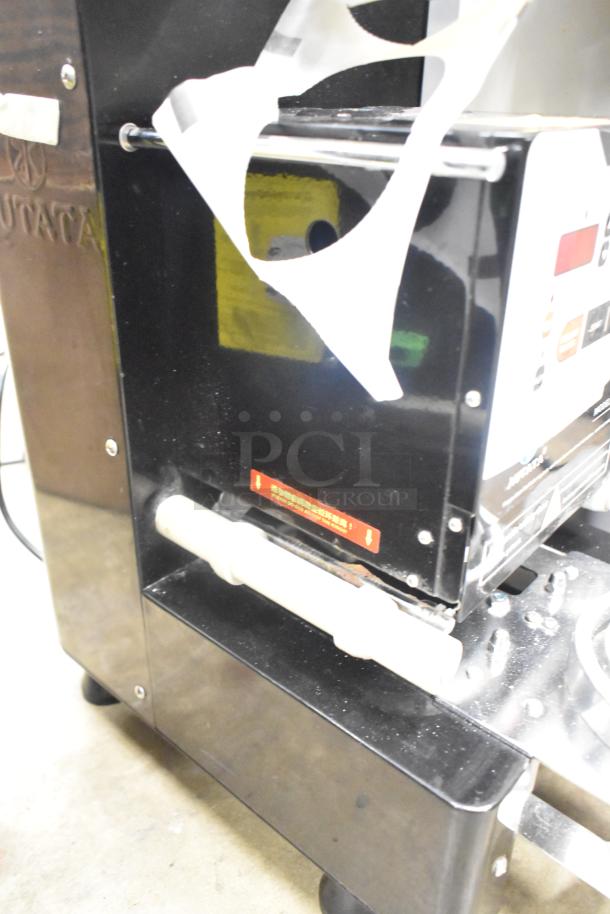 Autata ATT-95N automatic plastic cup sealing machine, 115 volts, 1 phase. Gently used with visible control panel and branding.