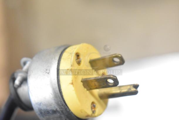 Close-up of a power plug for the Autata ATT-95N Automatic Plastic Cup Sealing Machine, 115 Volts, 1 Phase.