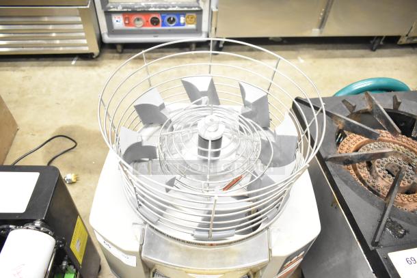 Zummo Z14C Commercial Countertop Citrus Juicer, 110 Volts, 1 Phase, with rotating drum and wire basket, in used condition.