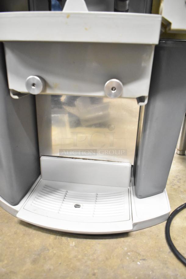 Zummo Z14C Commercial Citrus Juicer, 110V, 1 Phase. Visible wear marks, clean exterior, with functioning drip tray.