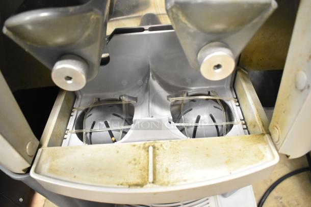 Zummo Z14C commercial citrus juicer, showing inner components. Slight wear visible, suitable for countertop use, 110V.