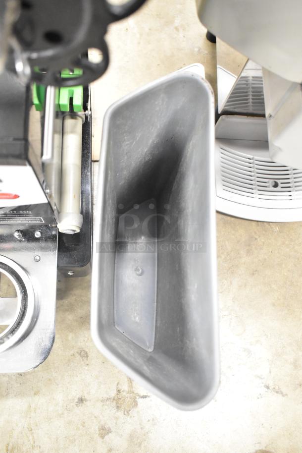 Zummo Z14C commercial countertop citrus juicer, visible from above. Black and silver components, used condition.