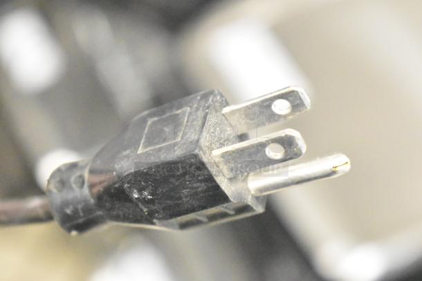 Close-up of the plug for a 2017 Hobart HTs-LS26 metal commercial countertop food portioning scale.